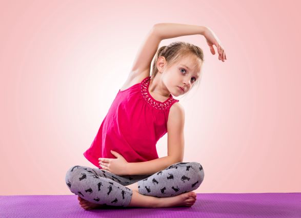 young girl in seated side stretch position